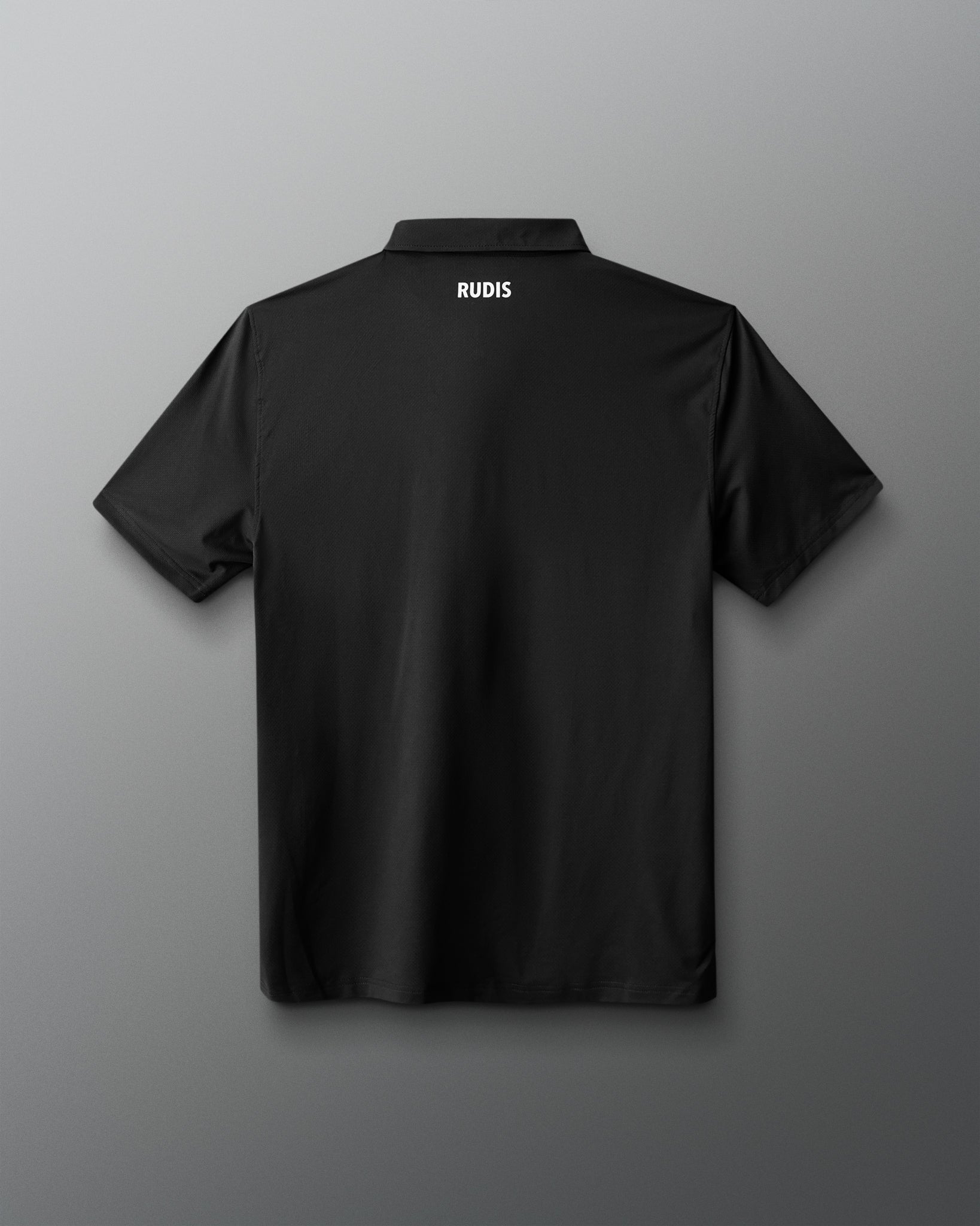 Black polo shirt with 'RUDIS' branding on the back against a gray background