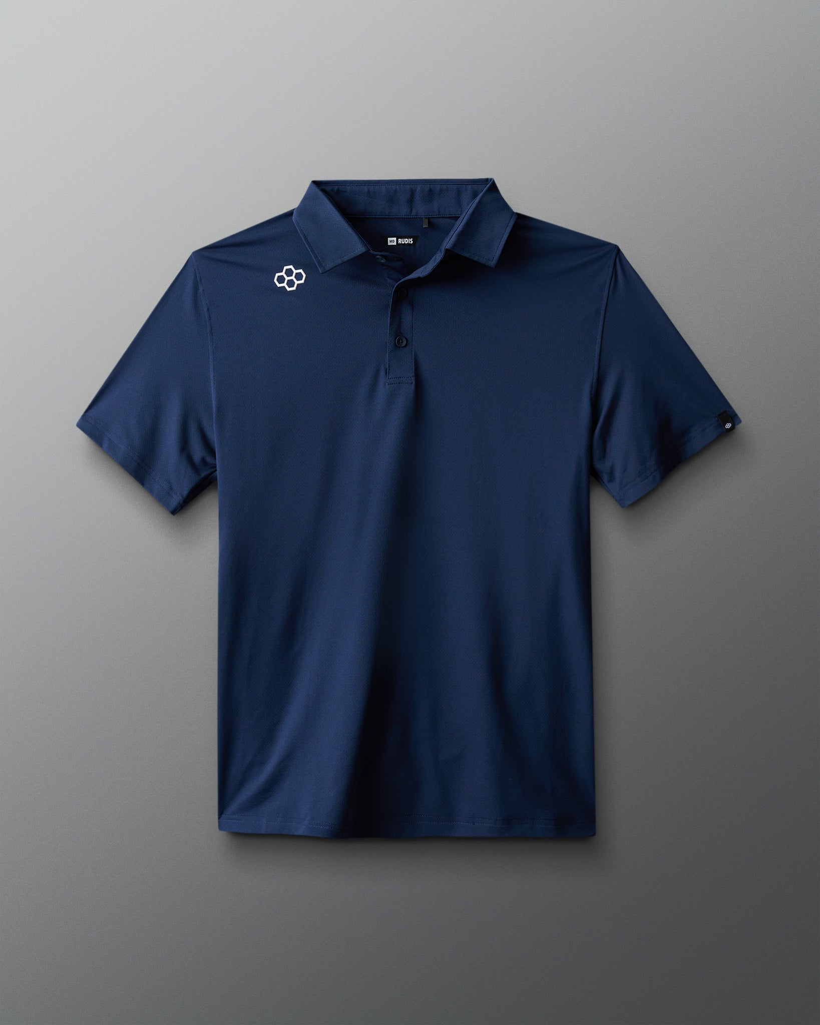 Navy blue polo shirt with a logo on a gray background