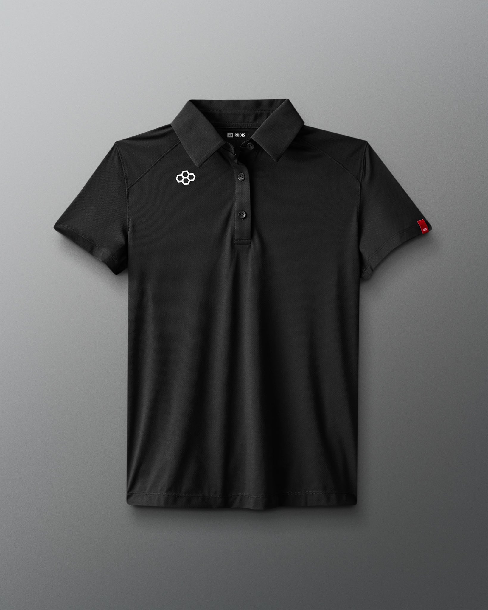 Black polo shirt with a logo on a gray background