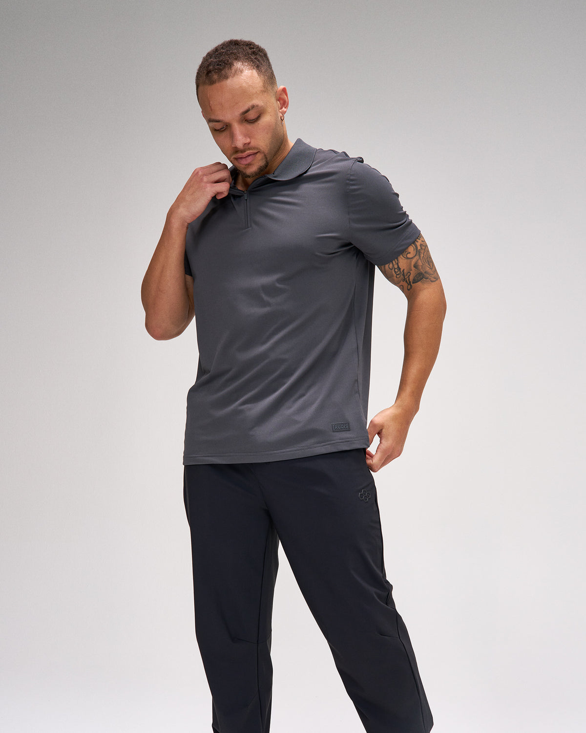 Polo zippé en piqué extensible RUDIS