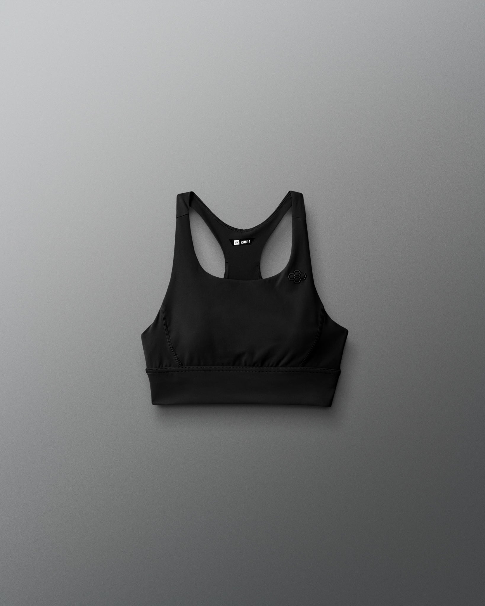 Black sports bra on a gray background
