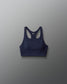 Navy blue sports bra on a gray background