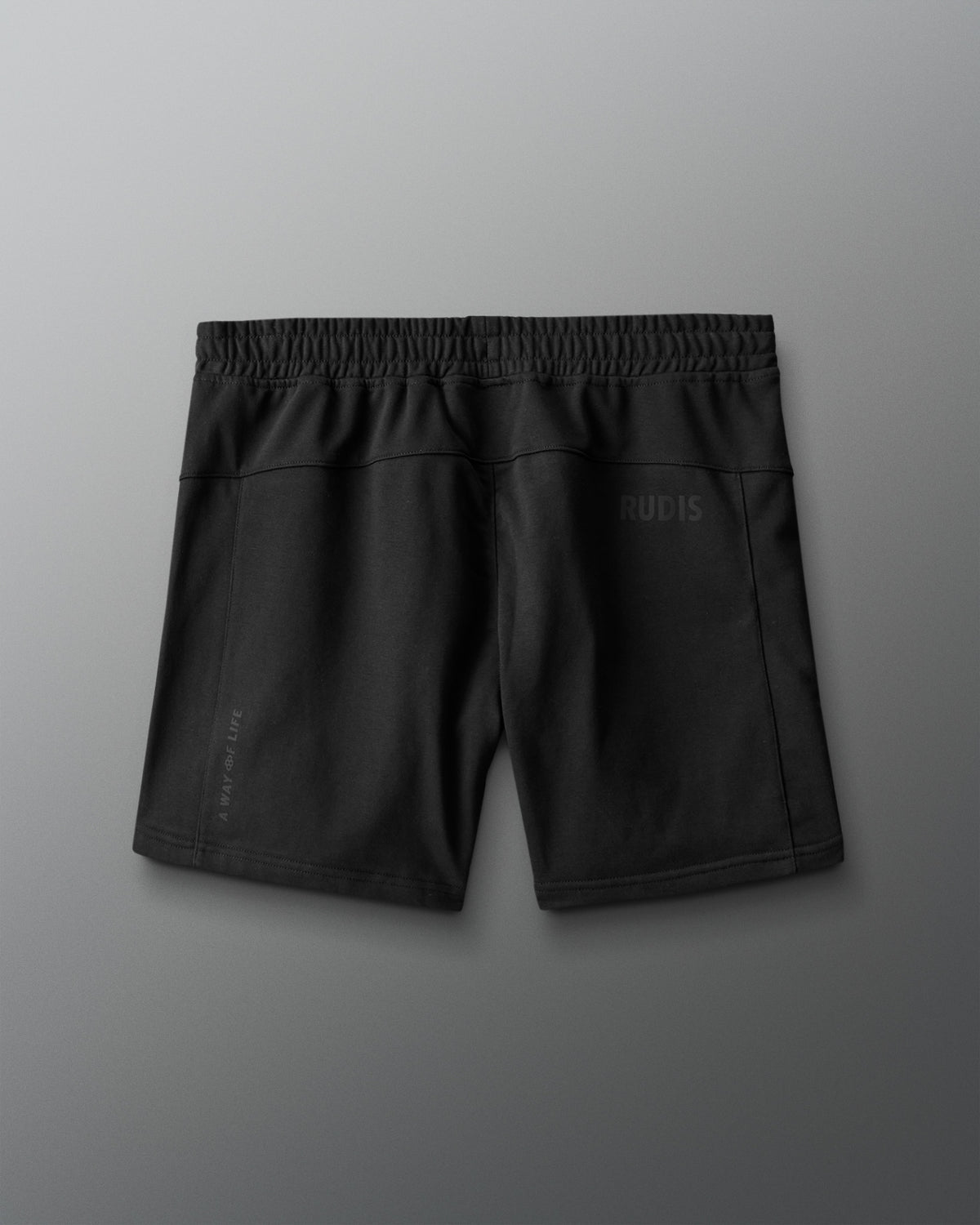 Black shorts with a brand logo on a gray background