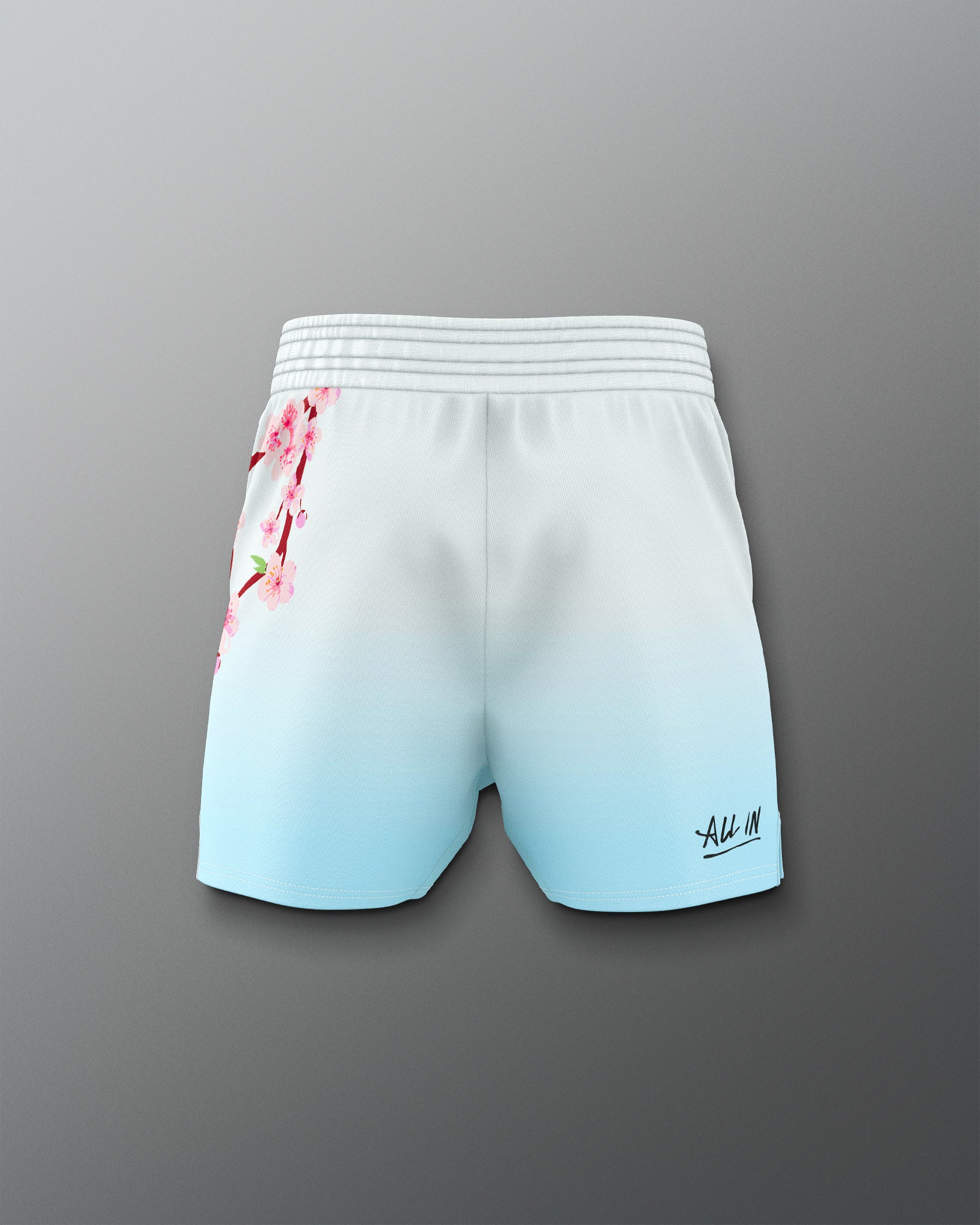 Gradient shorts with floral design on a gray background