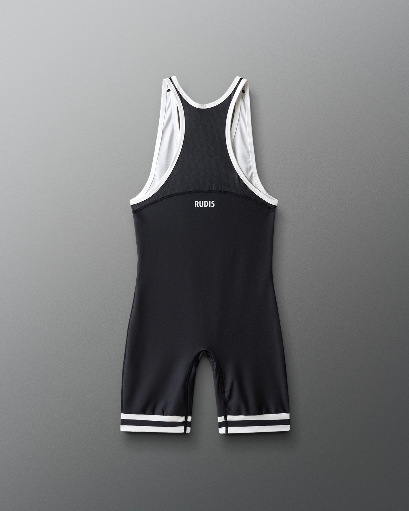 Black and white wrestling singlet with 'RUDIS' branding on a gray background