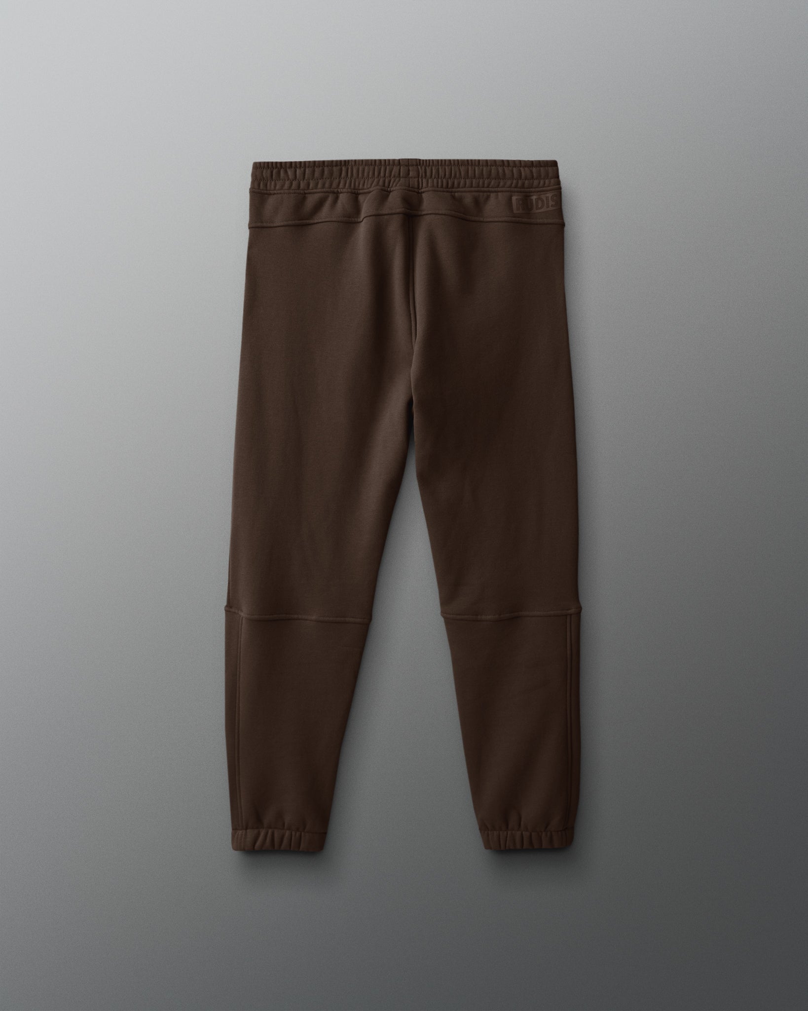 Brown pants on a gray background