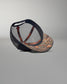 Cap with camouflage front and black mesh back on a gray background