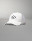 Front angled view of the RUDIS Bridge Trucker Hat in White, featuring an embroidered black RUDIS Bridge logo, curved brim and breathable white mesh panels.