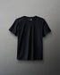 A black textured waffle material t-shirt displayed against a neutral background.