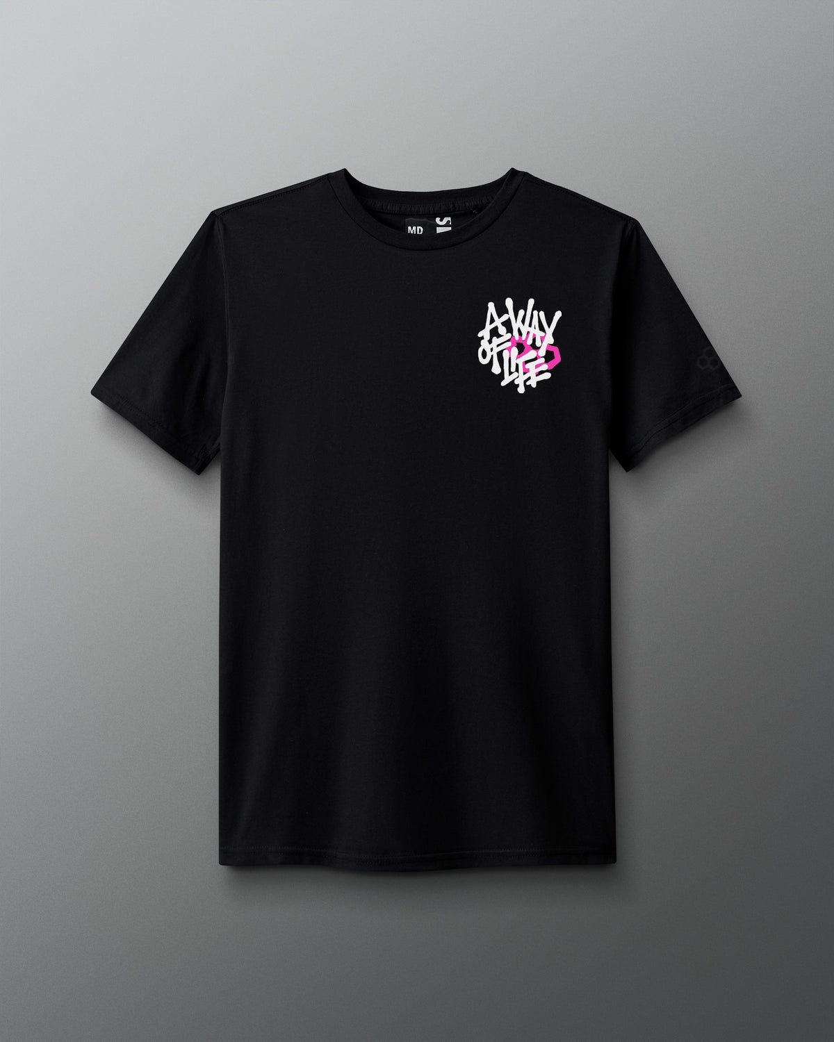 Front view of a black T-shirt with a small white and pink graphic on the left chest that reads ‘A Way of Life’ in stylized overlapping text.