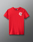 Front view of a red T-shirt with a small white and pink graphic on the left chest that reads ‘A Way of Life’ in stylized overlapping text.