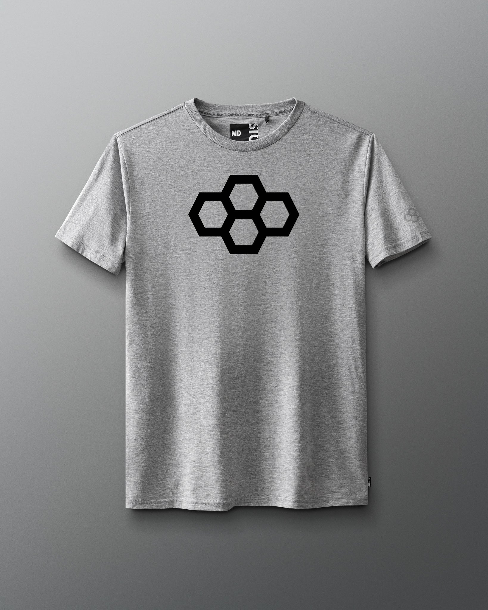 A gray t-shirt with a white quadhex graphic design on the front and a smaller hexagonal logo on the left sleeve.