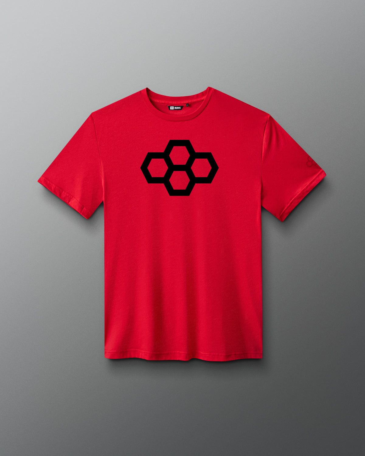 A red t-shirt with a black quadhex graphic design on the front and a smaller hexagonal logo on the left sleeve.