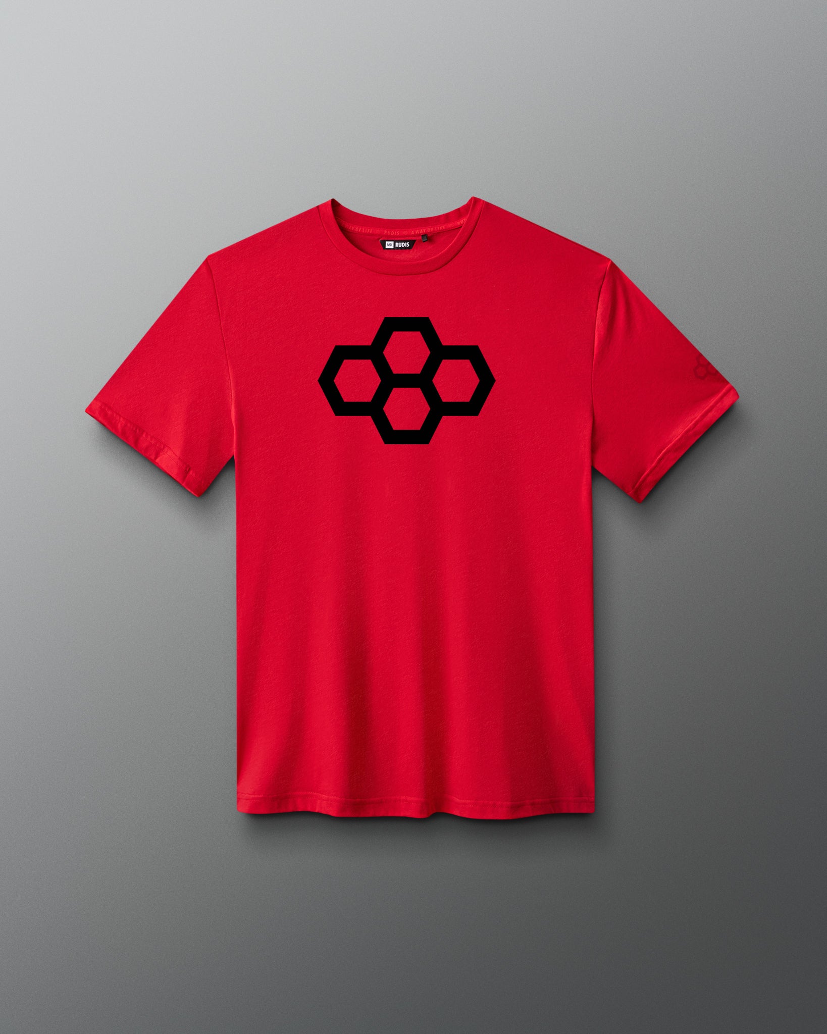 A red t-shirt with a black quadhex graphic design on the front and a smaller hexagonal logo on the left sleeve.