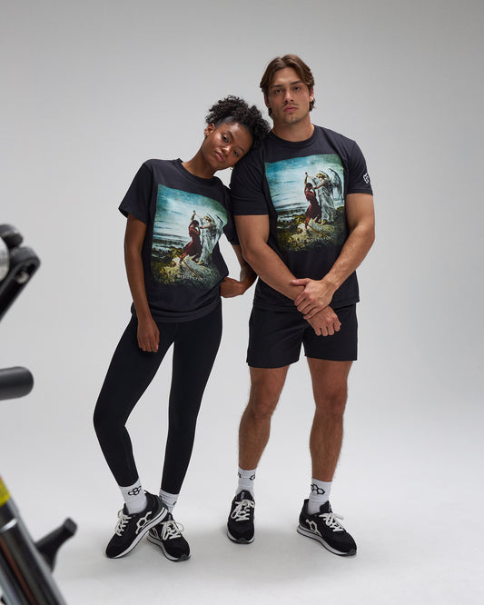 Two people wearing matching graphic t-shirts on a plain background. Faith Over Fear Divine Struggle Wrestling shirt graphics