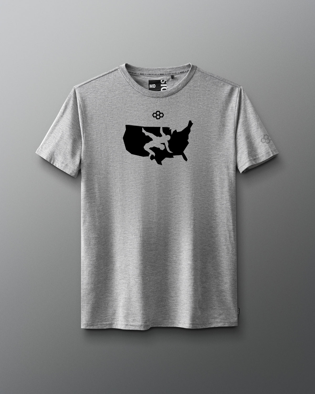Gray t-shirt front with black usa wrestling logo graphic design on a gradient background
