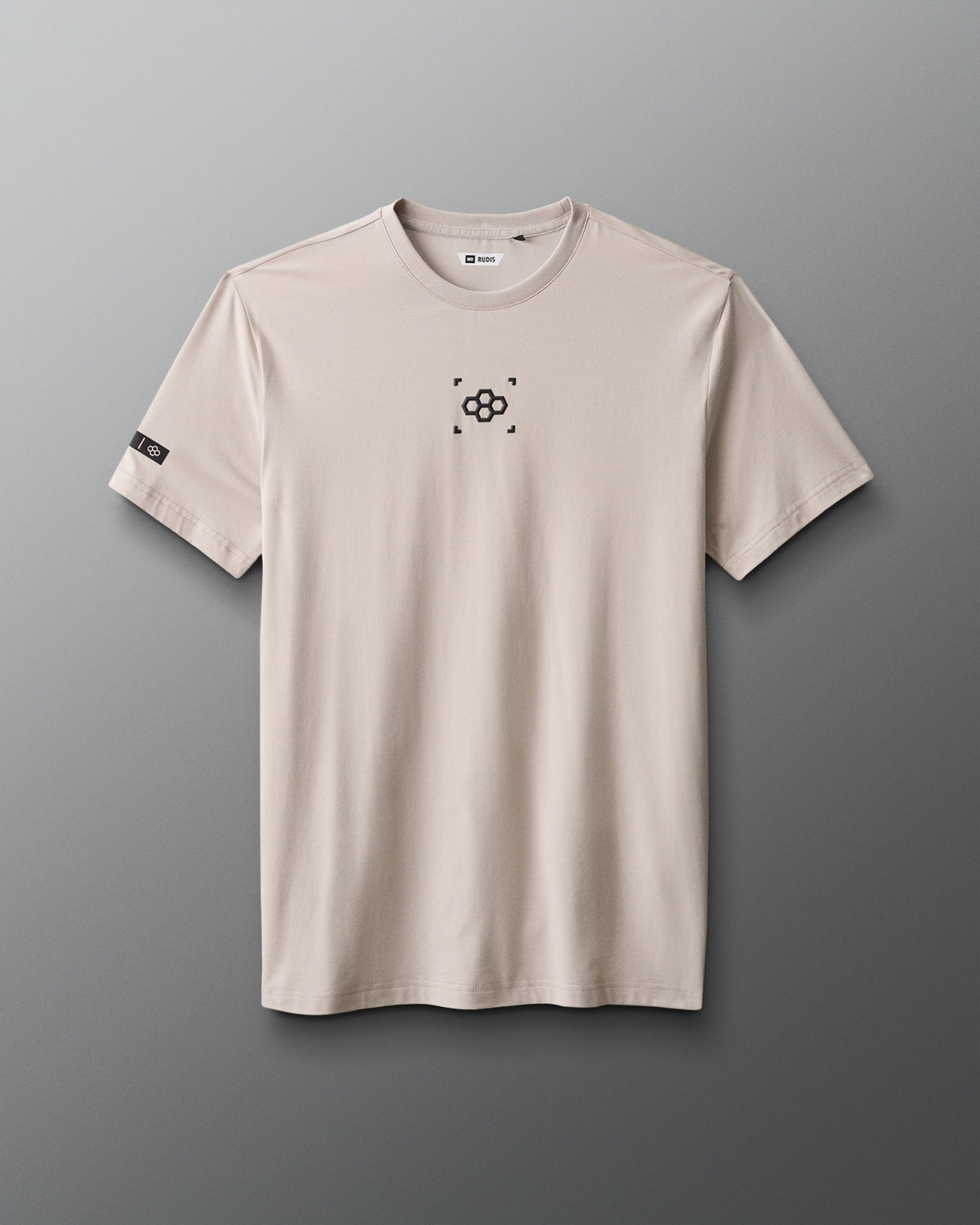 Beige t-shirt with a black logo on a gray background