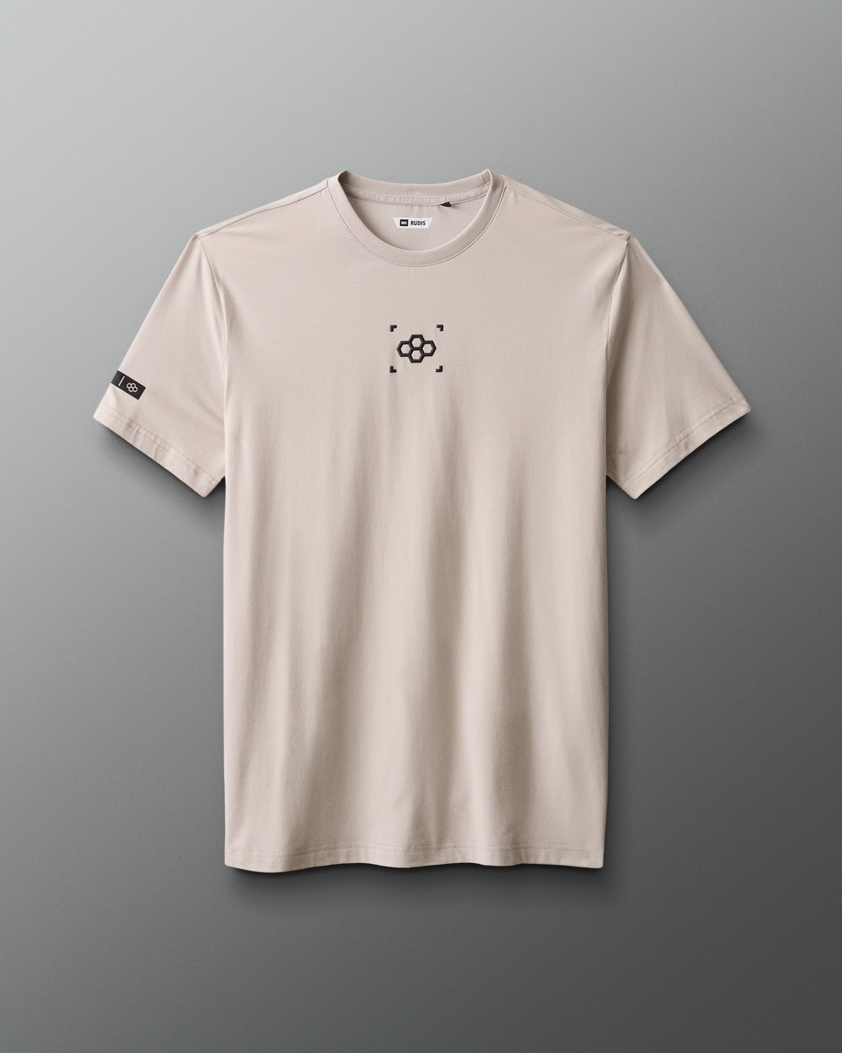 Beige t-shirt with a black logo on a gray background
