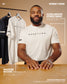 Man wearing a 'Wrestling' t-shirt with text about the shirt's features on a beige background.