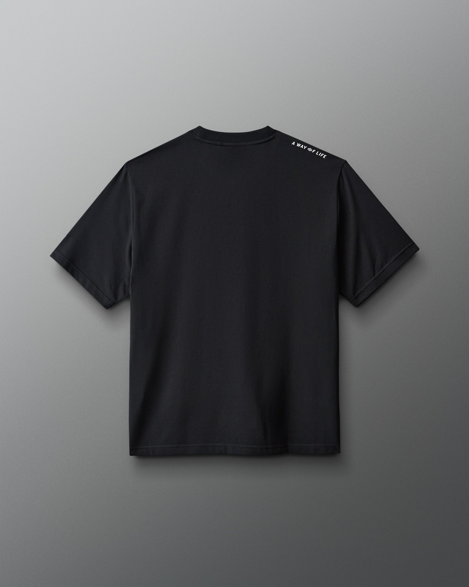 Black t-shirt with a logo on the back against a gray background