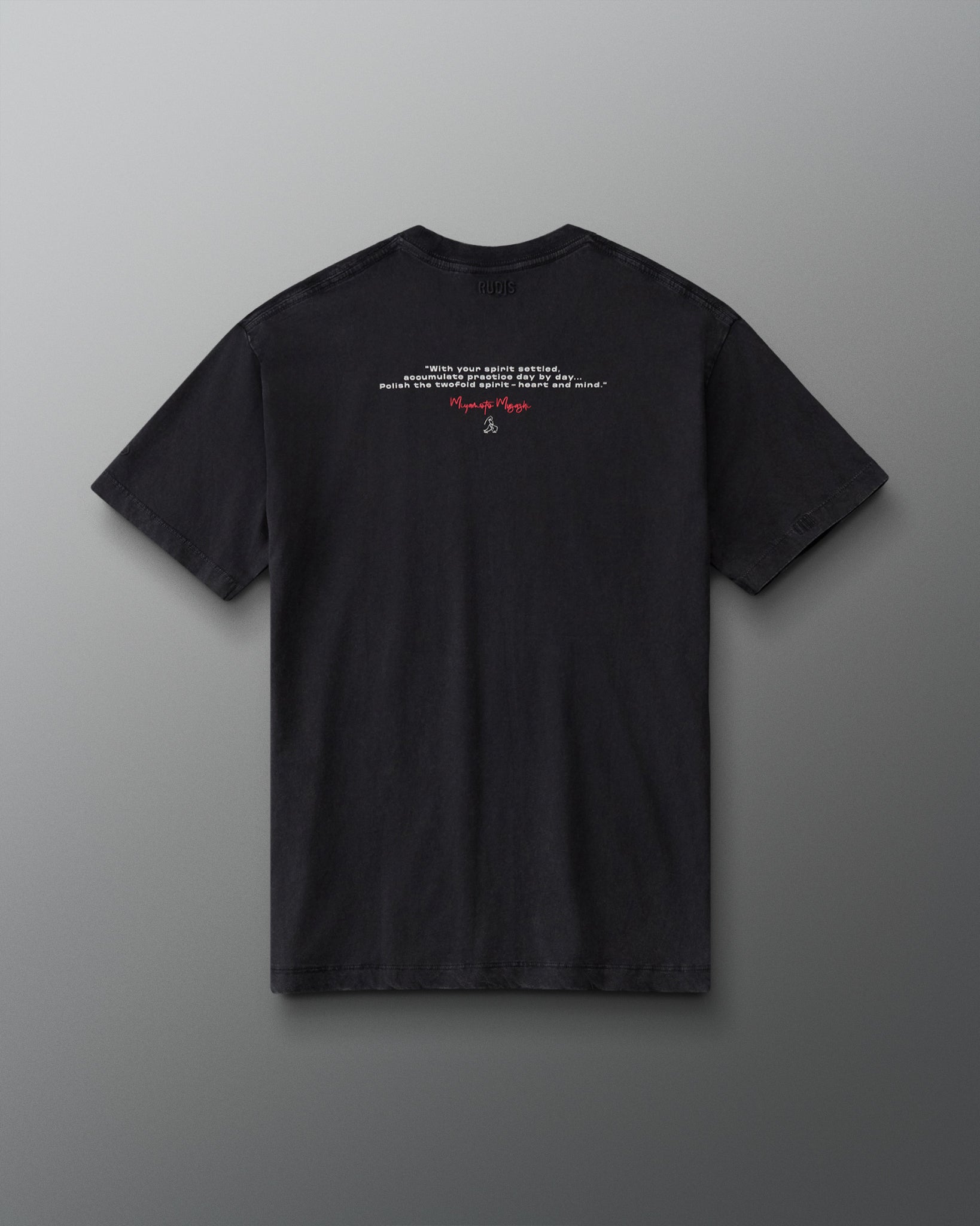 Back view of the RUDIS Samurai Kokoro Classic Cotton T-Shirt in Washed Black, featuring an inspirational Miyamoto Musashi quote, red signature graphic and subtle RUDIS branding.
