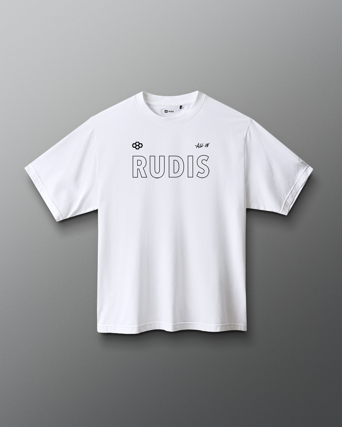 A white short-sleeve crewneck t-shirt with 'RUDIS' printed across the chest in a thin black outline font, accompanied by small black logos on the left chest, shown against a dark gray gradient background.