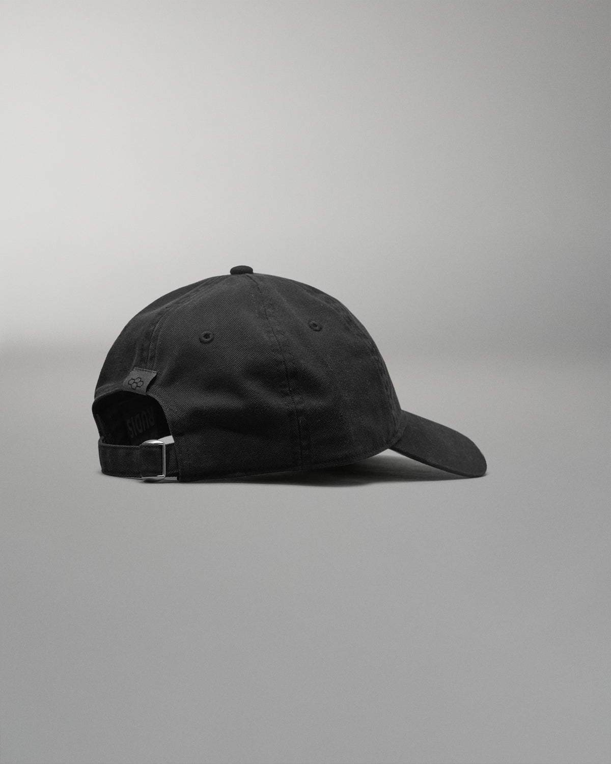 Black cap on a gray background