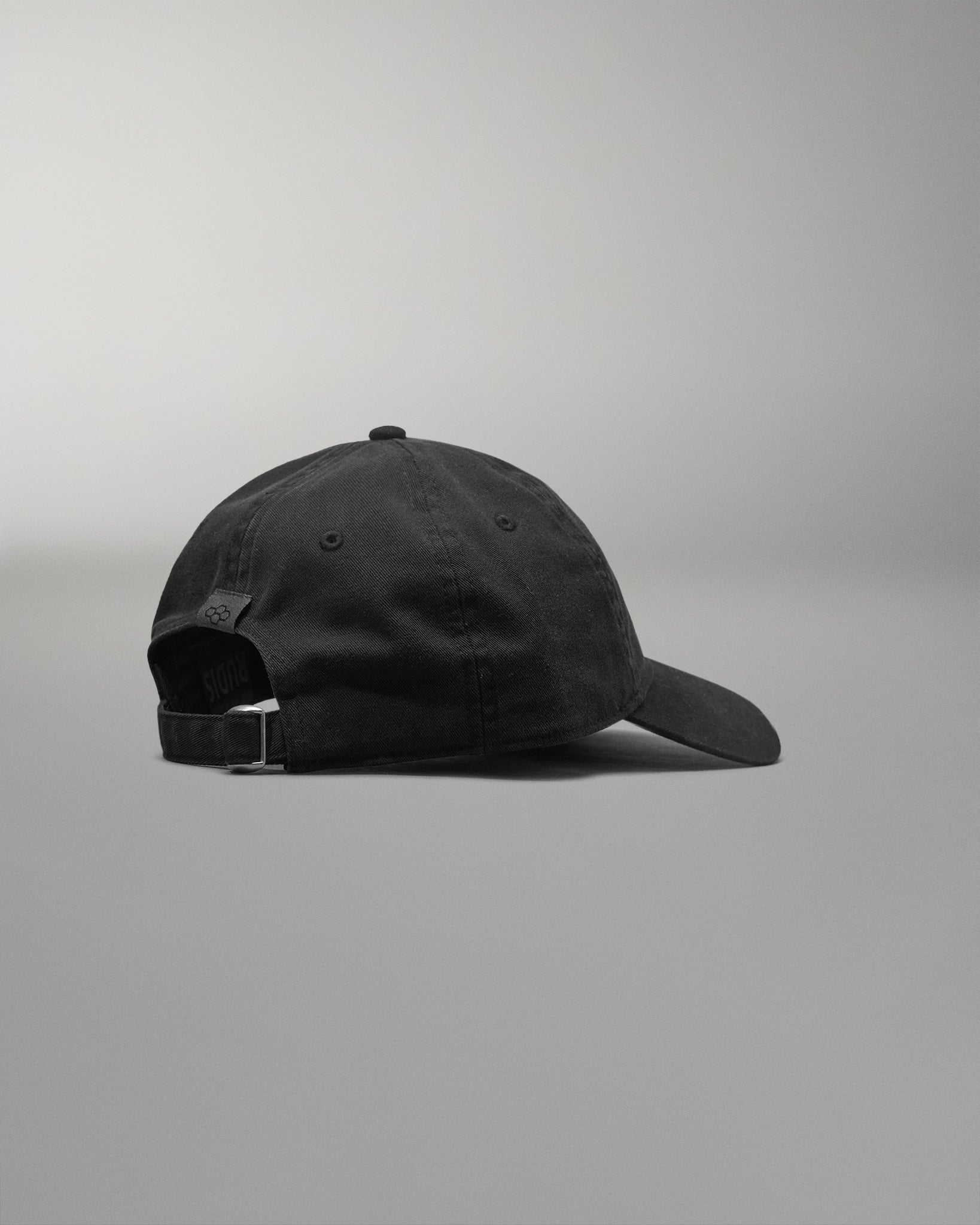 Black cap on a gray background