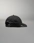 Black cap on a gray background