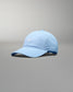 Light blue baseball cap on a gray background