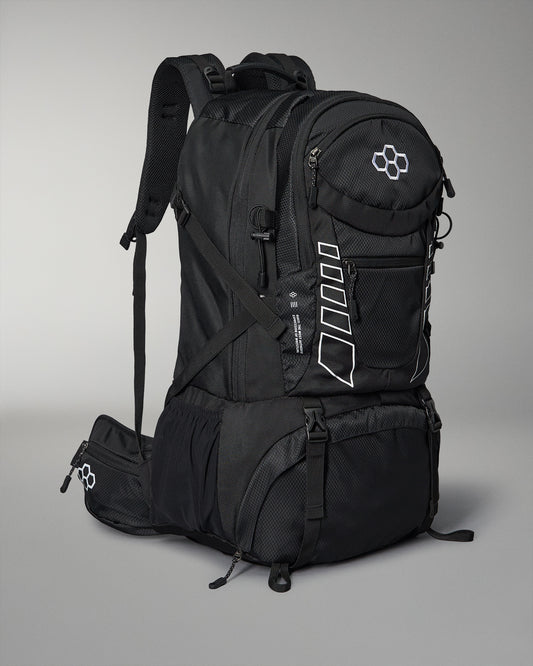 A sleek black wrestling backpack with multiple compartments and adjustable padded straps features white accents and a logo, set against a gray background.