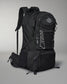 A sleek black wrestling backpack with multiple compartments and adjustable padded straps features white accents and a logo, set against a gray background.