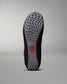 The sole of a shoe combines a textured black design with a wavy gray pattern and a central red logo, highlighting its performance-oriented features.