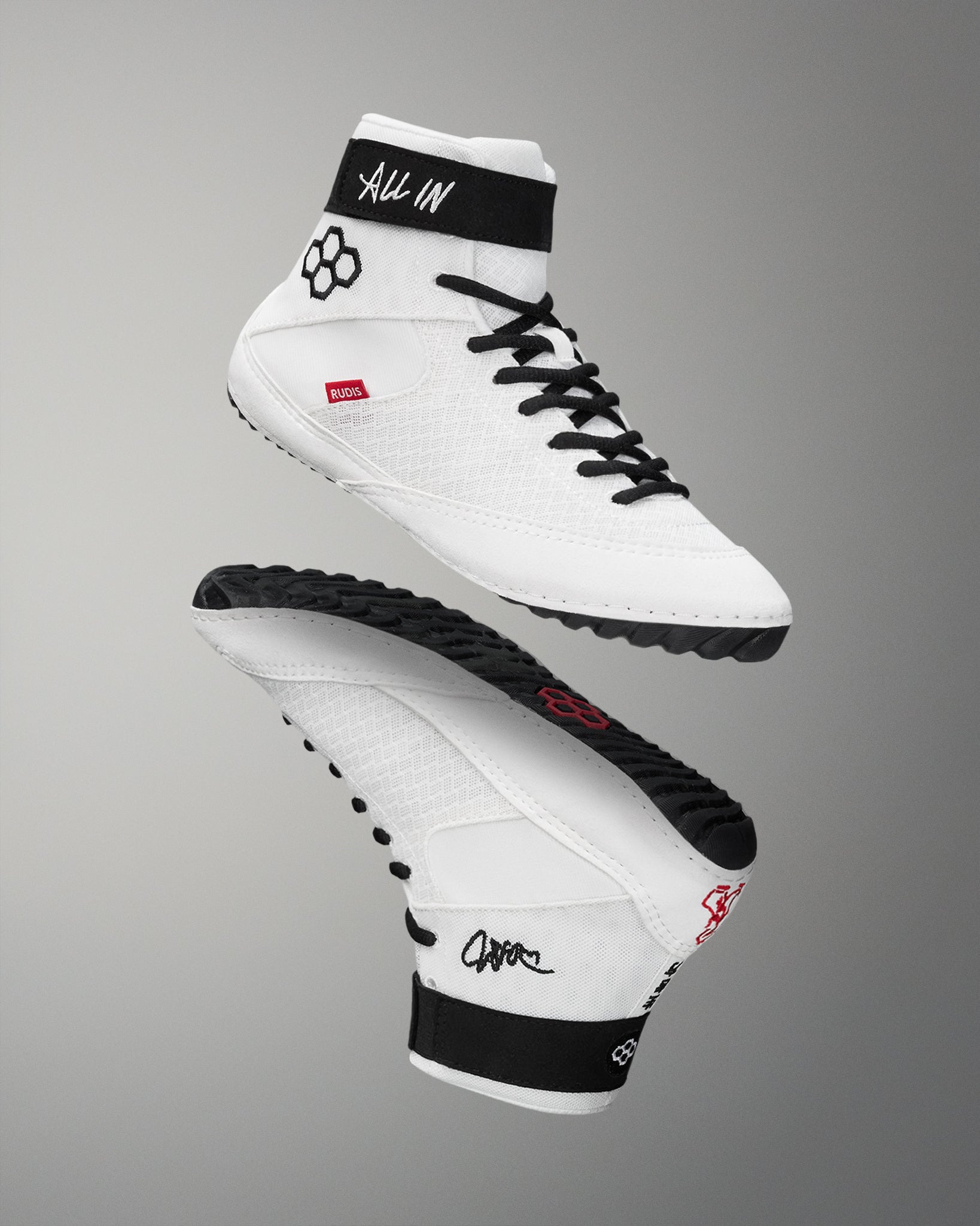 White wrestling shoes with black accents on a gray background