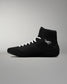 Black wrestling shoe with white laces on a gray background