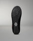 Black wrestling shoe sole with a brand logo on a gray background