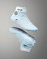 Light blue wrestling shoes with white laces on a gray background