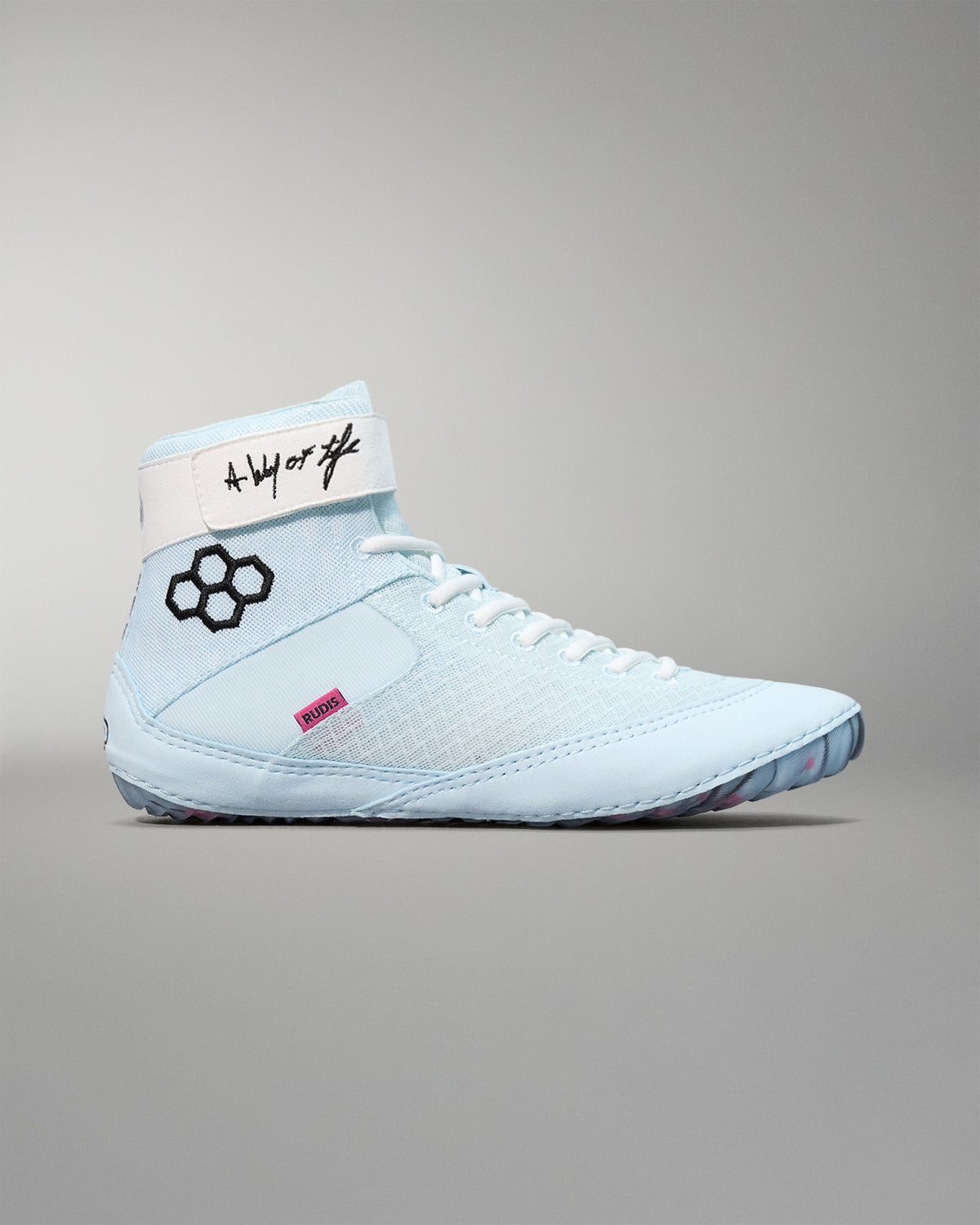 Light blue wrestling shoe with black logo on a gray background