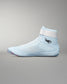 Light blue wrestling shoe with white accents on a gray background