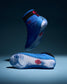 RUDIS Samurai Speed Ikigai wrestling shoes in vibrant blue, showcasing wave-inspired translucent soles, black ankle straps, and red RUDIS logos.