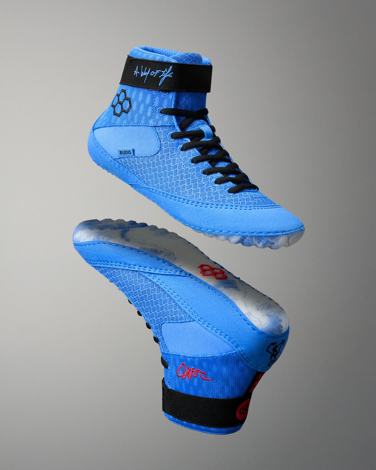 RUDIS Samurai Speed Ikigai wrestling shoes in blue, featuring black laces, ankle straps, signature graphics, and wave-patterned outsoles.