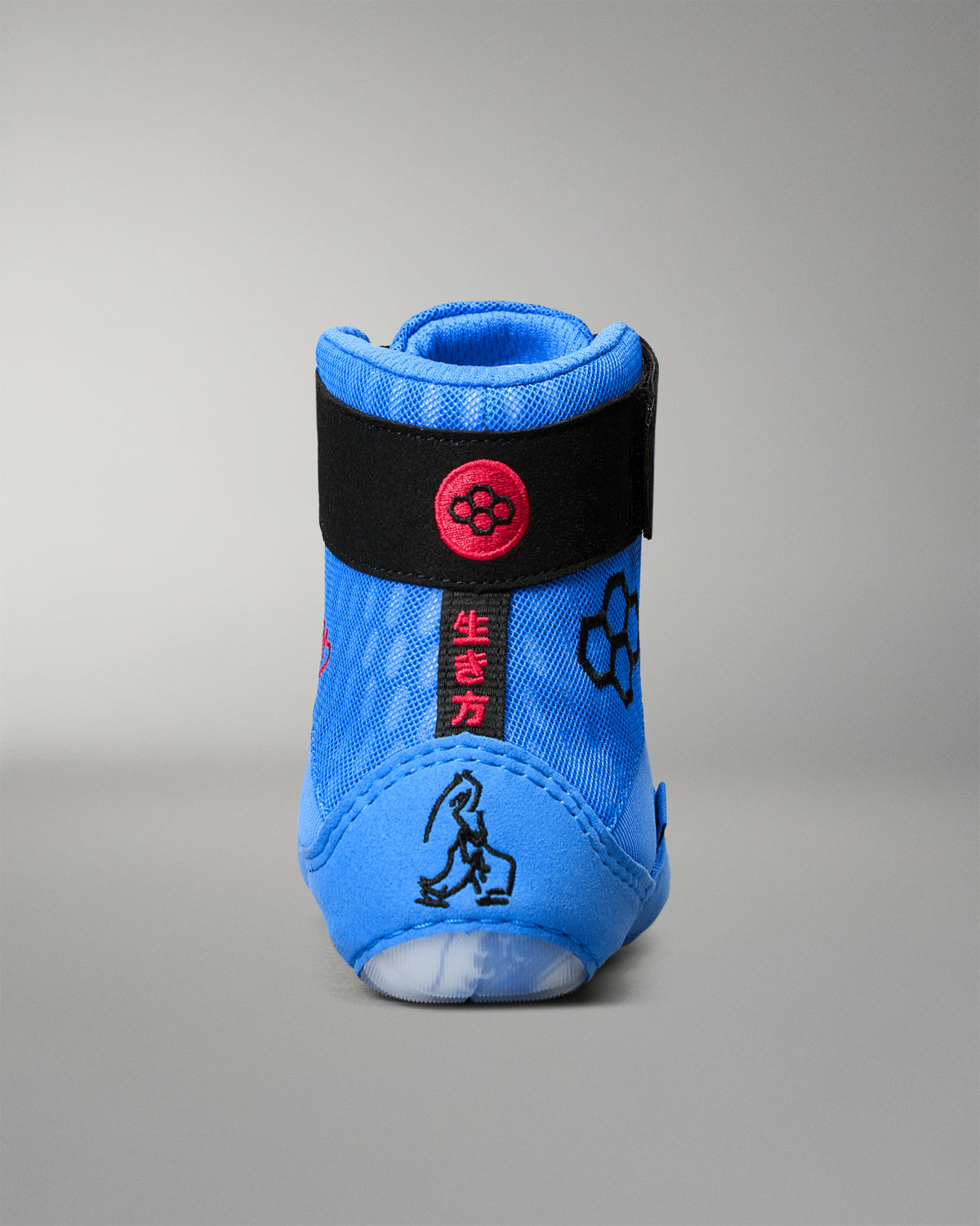 Rear view of RUDIS Samurai Speed Ikigai wrestling shoe showing blue heel construction, black ankle strap, red detailing, and Japanese-inspired graphics.
