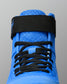 Close-up of RUDIS Samurai Speed Ikigai wrestling shoe showcasing textured blue mesh, black laces, and ankle strap stitching.