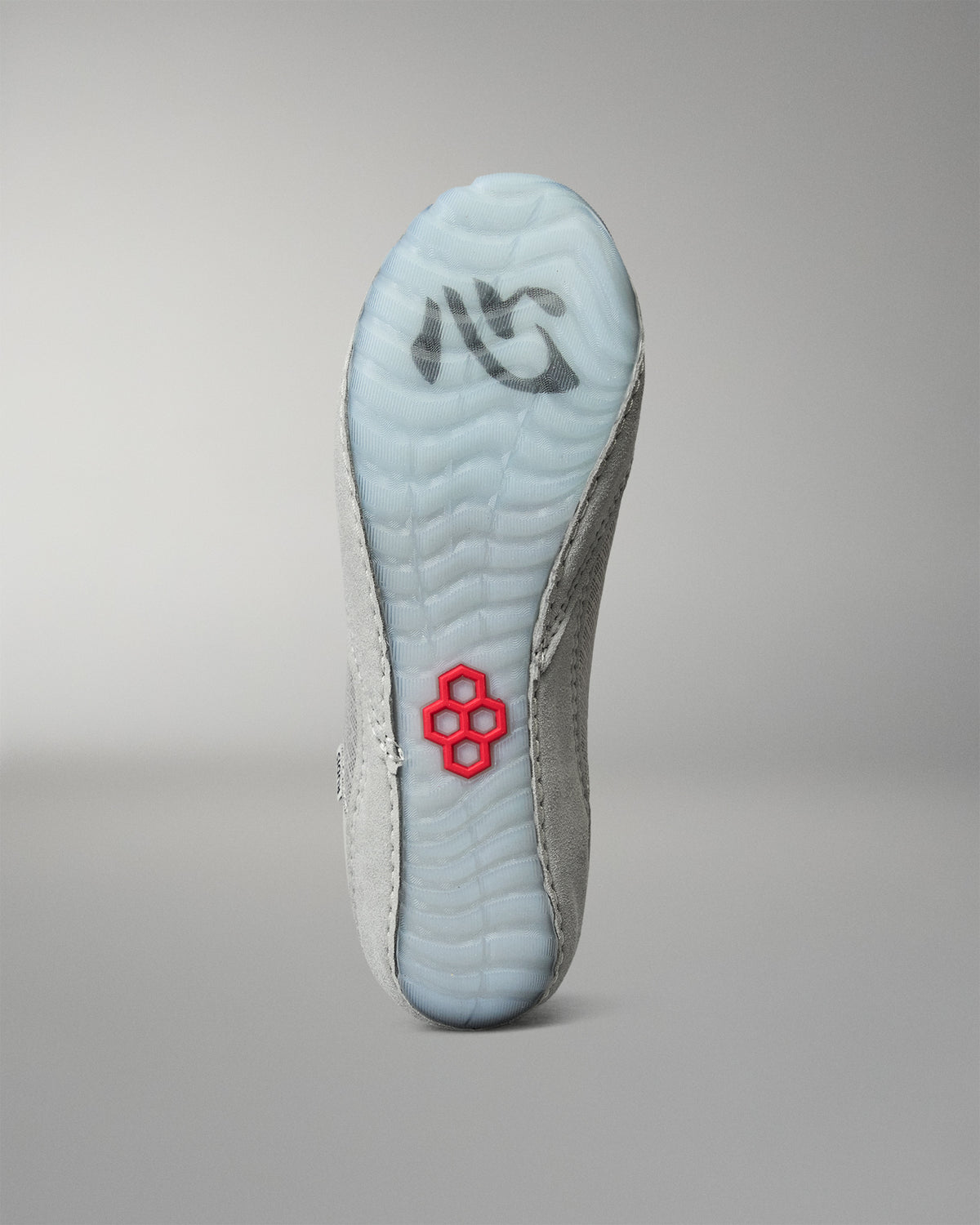 Bottom view of the RUDIS Samurai Speed Kokoro wrestling shoe, highlighting the translucent light blue outsole, textured traction pattern, and red RUDIS emblem.