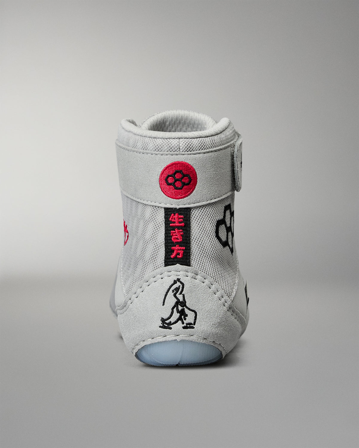 Rear view of the RUDIS Samurai Speed Kokoro wrestling shoe, featuring an embroidered red RUDIS emblem, Japanese characters, and distinctive black heel artwork.