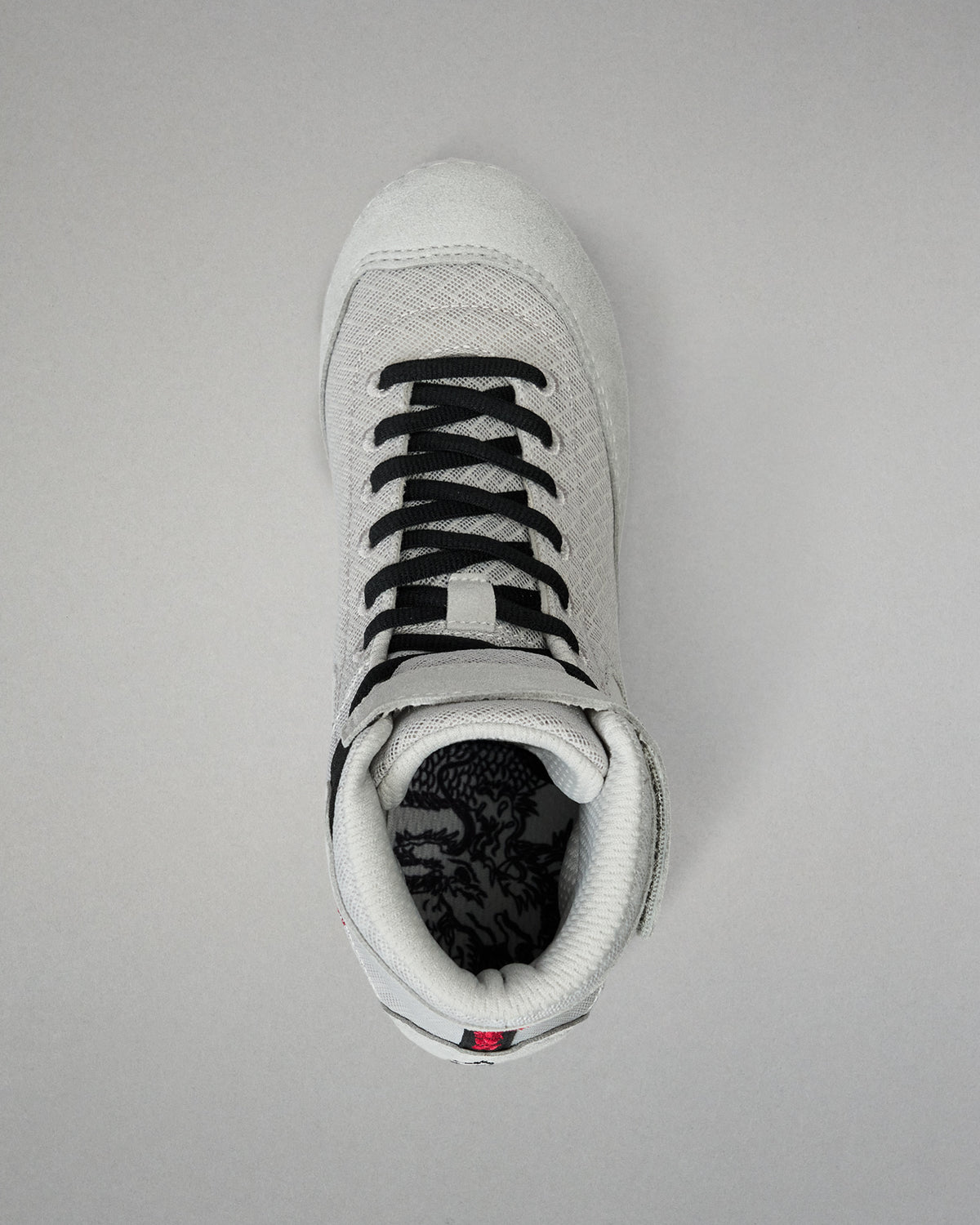 Top-down view of the RUDIS Samurai Speed Kokoro wrestling shoe, showing black laces, padded ankle collar, gray mesh upper, and detailed interior footbed artwork.
