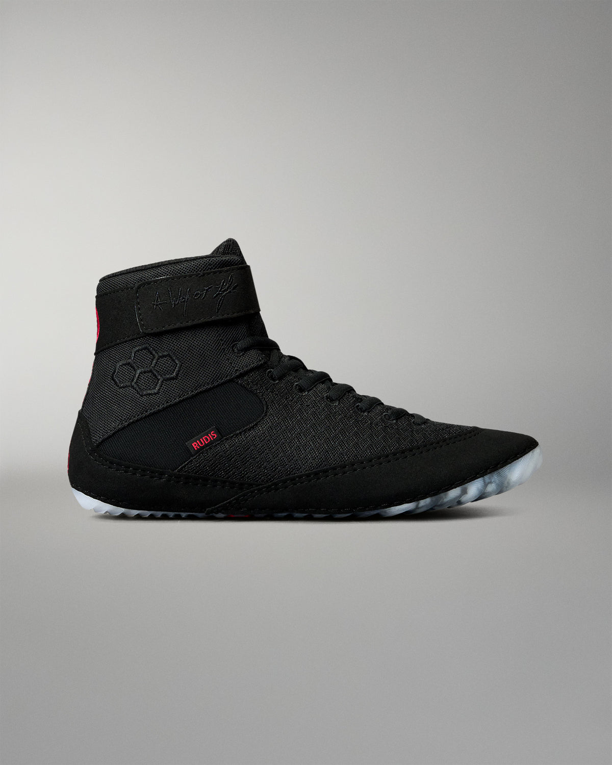 Outer side view of the RUDIS Samurai Speed Adult Wrestling Shoe in Wabi-Sabi black, featuring a lace-up design, ankle strap, red RUDIS branding, and translucent sole.
