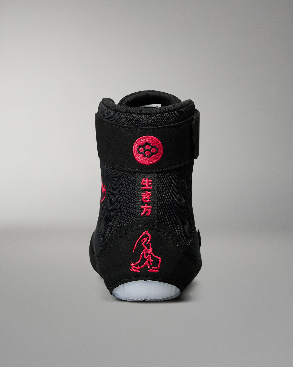 Rear view of the RUDIS Samurai Speed Wabi-Sabi wrestling shoe in black, highlighting red embroidered Japanese characters, wrestling graphics, and RUDIS heel branding.