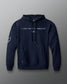 Front view of a navy hoodie featuring the phrase “I JUST WANT TO WRESTLE” in white block letters across the chest, with a signature printed below. Includes a front kangaroo pocket and subtle graphics on both sleeves.