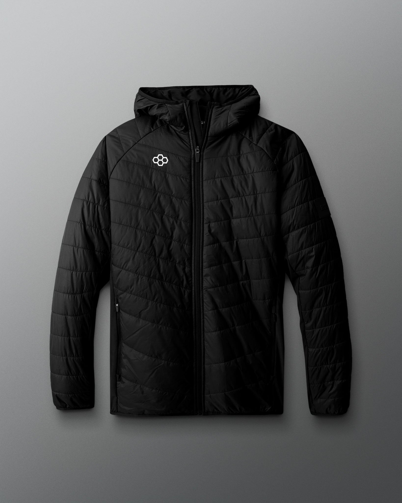 Black quilted jacket with a brand logo on a gray background